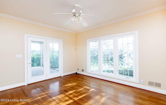 spare room featuring ornamental molding, wood-type flooring, and ceiling fan