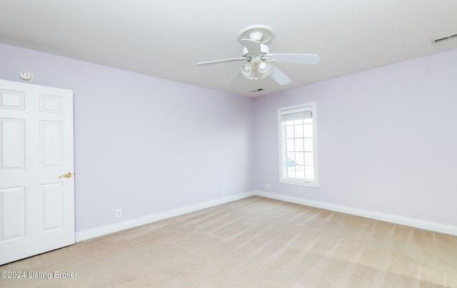 empty room with light carpet and ceiling fan