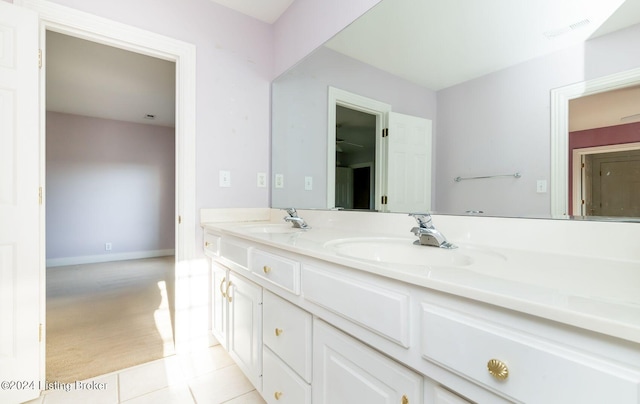 bathroom with tile patterned flooring and vanity