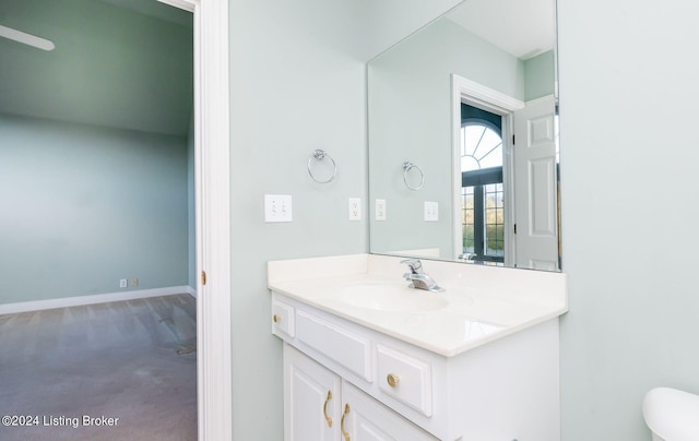 bathroom with vanity and toilet