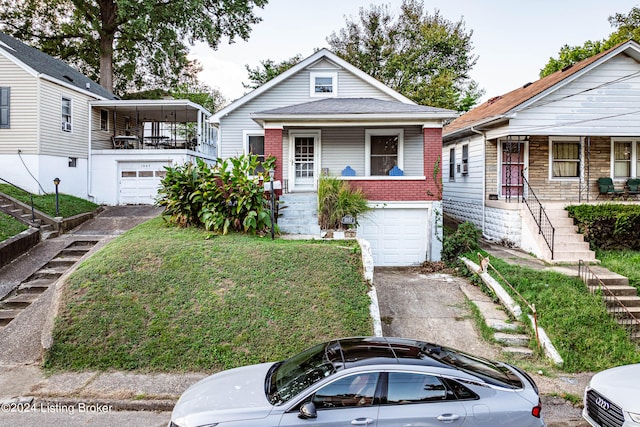 bungalow-style house with a porch and a garage