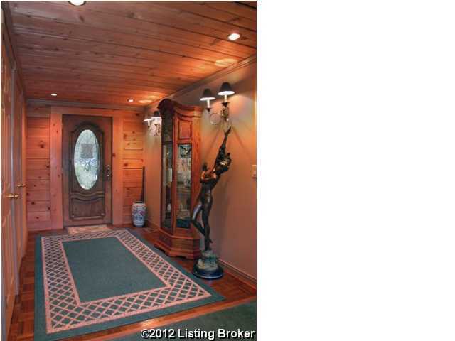 entryway with wooden ceiling, wood walls, and recessed lighting