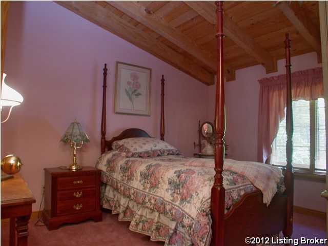 carpeted bedroom with wood ceiling and lofted ceiling with beams