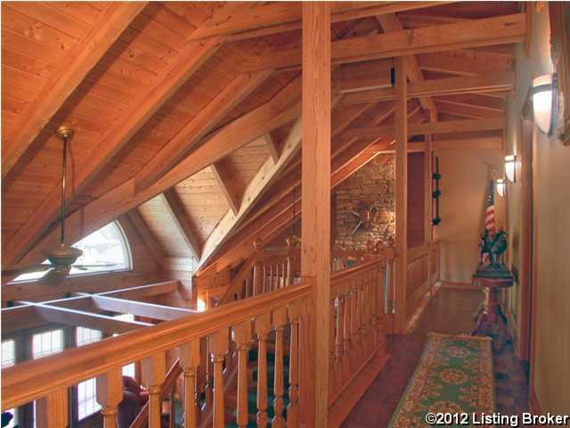 hallway featuring wooden ceiling, lofted ceiling with beams, and hardwood / wood-style floors