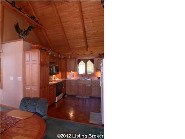 kitchen with light countertops, wood ceiling, a sink, vaulted ceiling with beams, and electric range