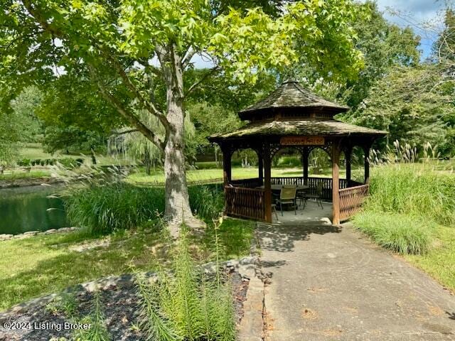 view of community featuring a water view and a gazebo