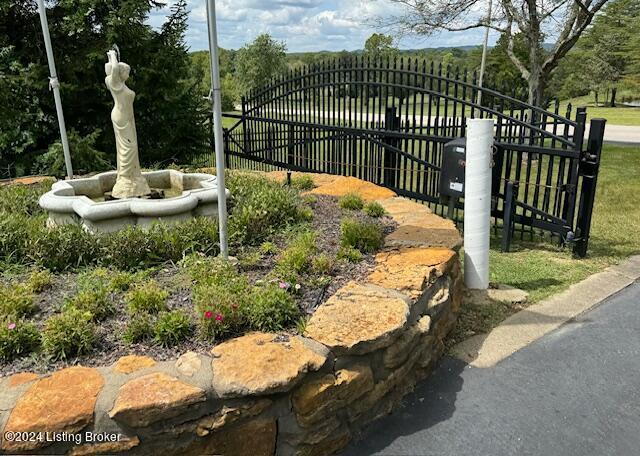surrounding community featuring a gate