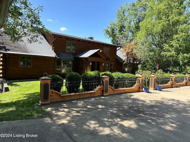 log home with a front lawn