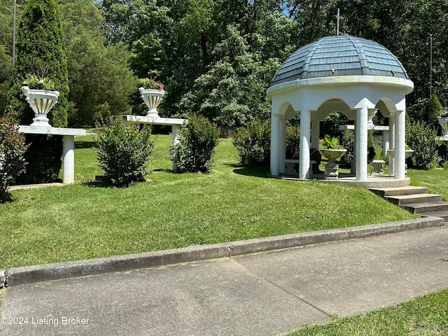 view of home's community featuring a lawn and a gazebo