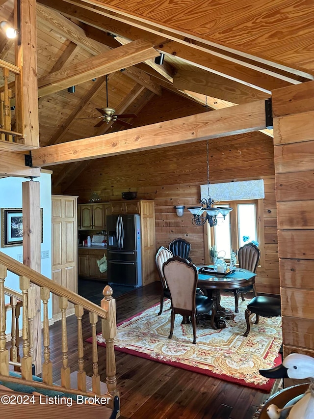 dining area featuring hardwood / wood-style flooring, beam ceiling, and high vaulted ceiling