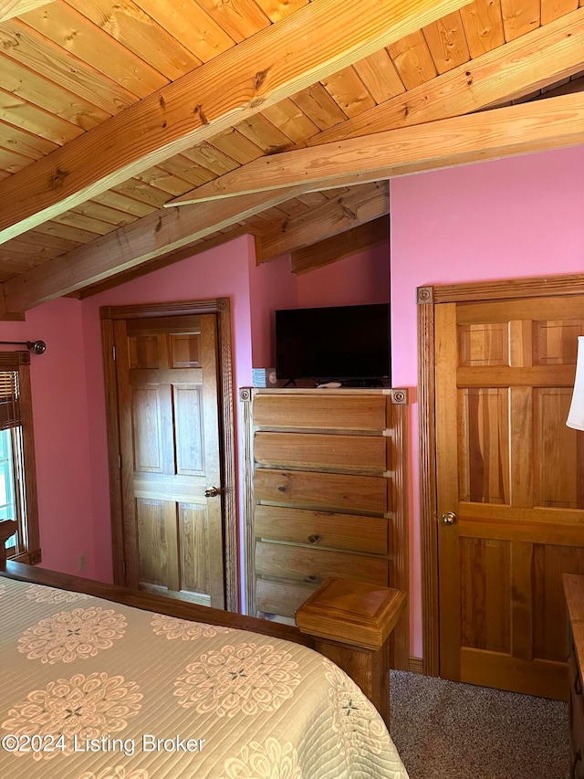 unfurnished bedroom featuring lofted ceiling with beams and wooden ceiling