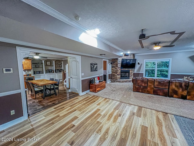 living room featuring light hardwood / wood-style floors and ornamental molding