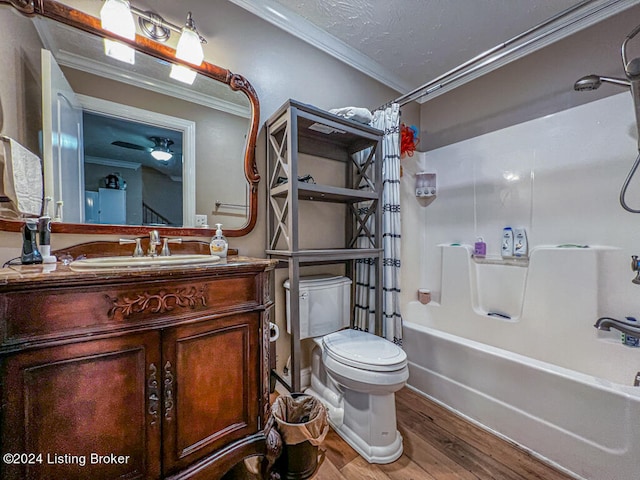 full bathroom with hardwood / wood-style floors, toilet, crown molding, and shower / tub combo with curtain