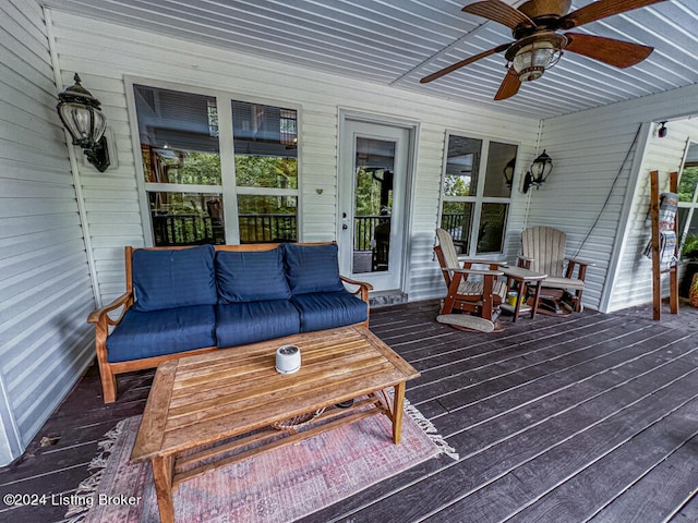 wooden deck featuring ceiling fan