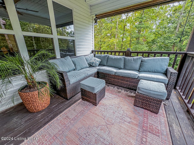 exterior space featuring outdoor lounge area, a deck, and ceiling fan