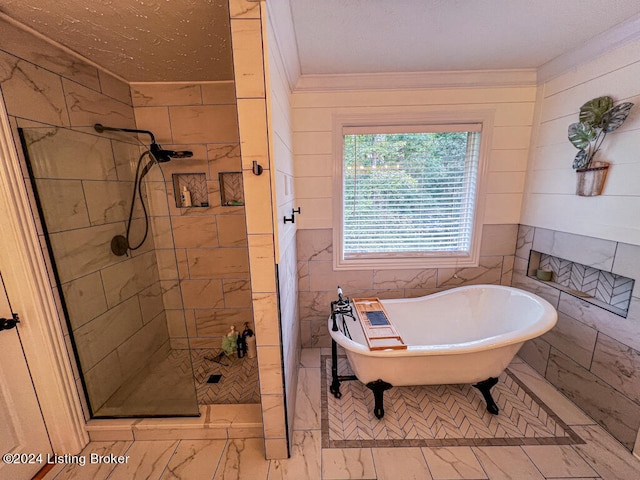 bathroom featuring crown molding, independent shower and bath, and tile walls