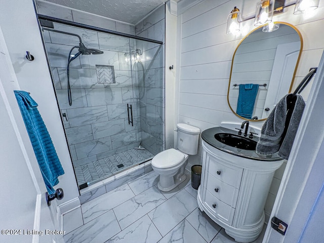 bathroom featuring vanity, wood walls, a textured ceiling, walk in shower, and toilet