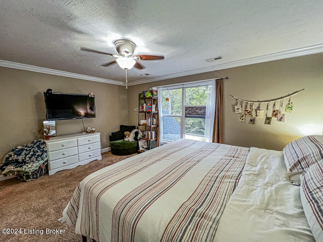 carpeted bedroom with a textured ceiling, ornamental molding, and ceiling fan