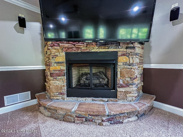 room details with a fireplace, ornamental molding, and carpet