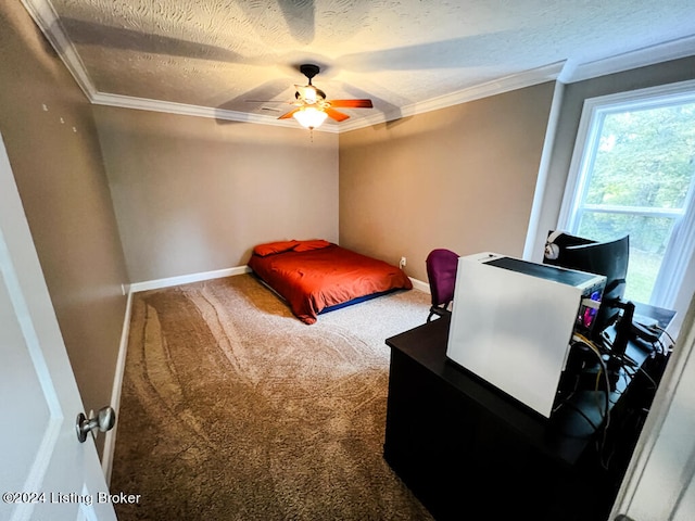 carpeted bedroom with ceiling fan, a textured ceiling, and crown molding