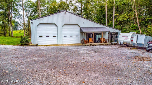 view of front of house featuring an outdoor structure and a garage