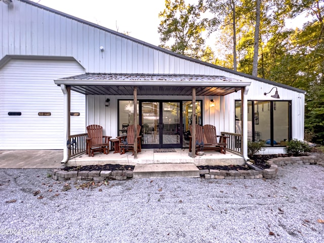 rear view of house with covered porch