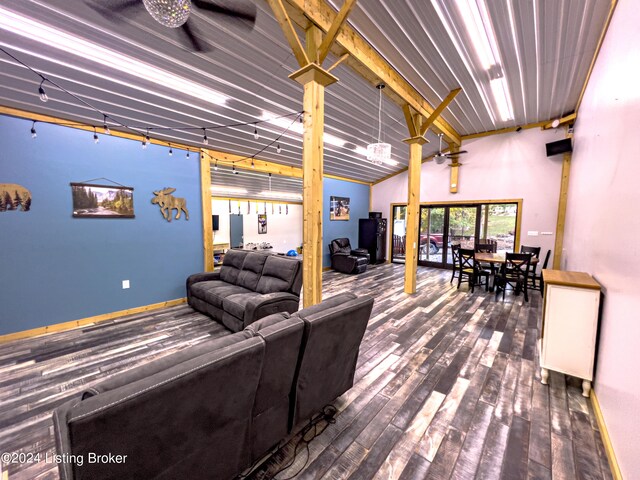 living room with hardwood / wood-style flooring and lofted ceiling