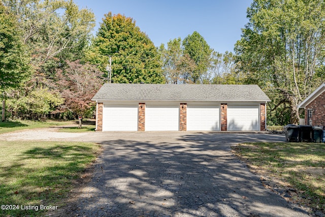 garage with a lawn