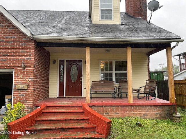 property entrance featuring covered porch