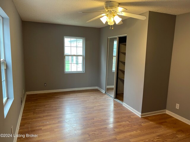1406 Cardinal Dr, Louisville, KY 40213 - unfurnished room with ceiling fan, a textured ceiling, and wood-type flooring