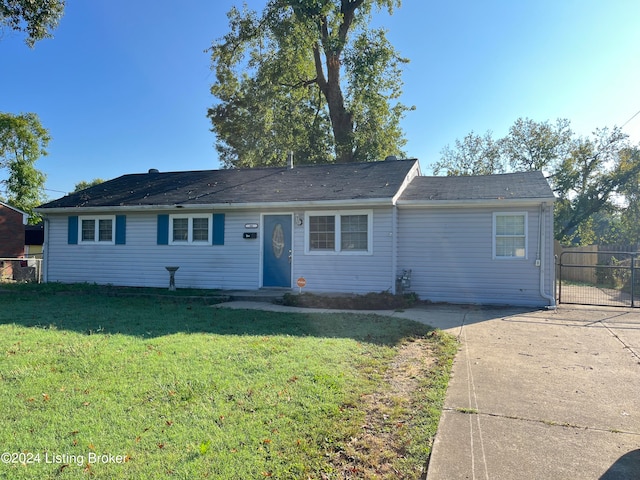 ranch-style home with a front lawn