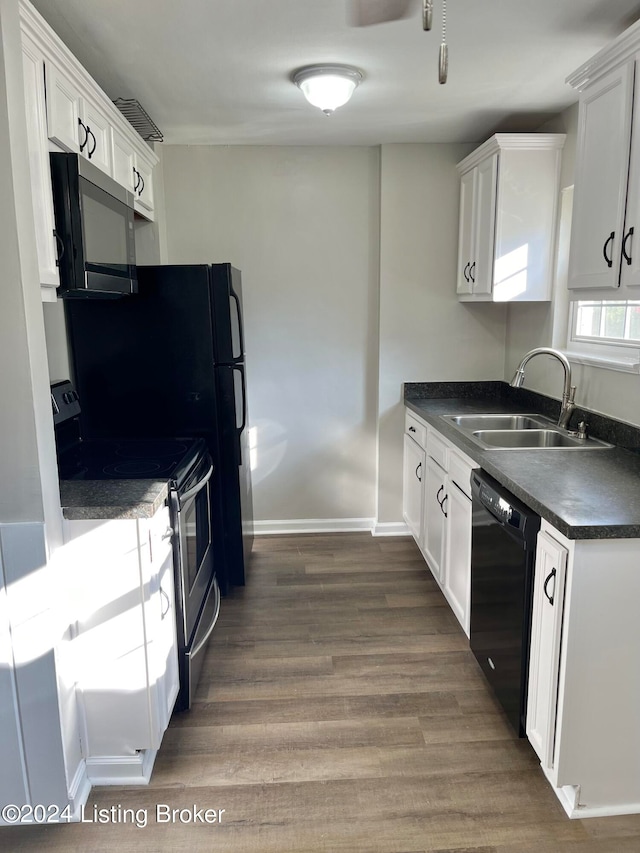 kitchen featuring black appliances, sink, dark hardwood / wood-style flooring, and white cabinetry