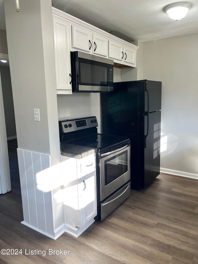 kitchen featuring white cabinetry, dark hardwood / wood-style flooring, and stainless steel appliances