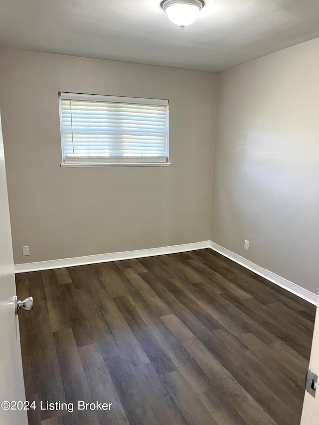 empty room featuring dark hardwood / wood-style floors