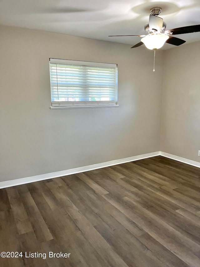 unfurnished room featuring ceiling fan and dark hardwood / wood-style floors