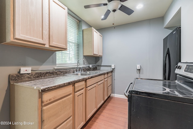 kitchen with sink, stainless steel electric range oven, light hardwood / wood-style flooring, light brown cabinets, and ceiling fan