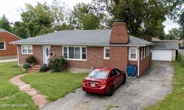 single story home with a front yard