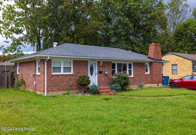 ranch-style home with a front lawn