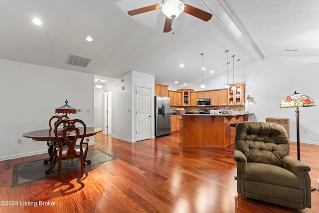 living room with ceiling fan, vaulted ceiling with beams, and light hardwood / wood-style flooring