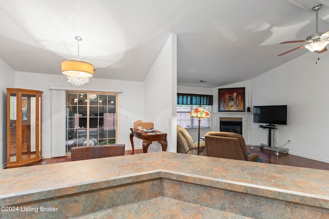 kitchen featuring lofted ceiling, ceiling fan, and hardwood / wood-style flooring