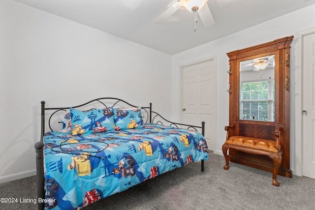 carpeted bedroom with ceiling fan