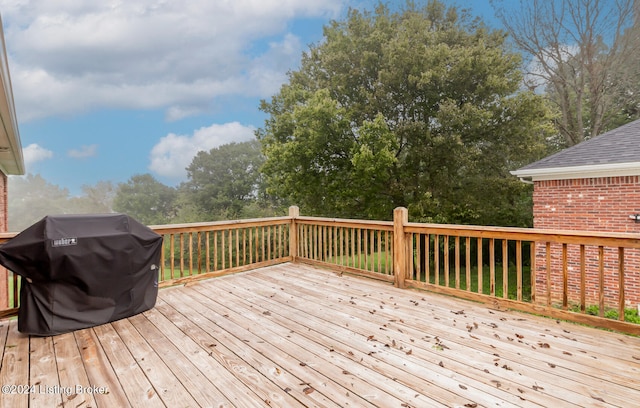 wooden terrace featuring grilling area