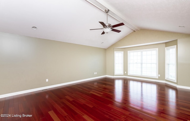 spare room with wood-type flooring, lofted ceiling with beams, and ceiling fan