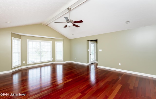 spare room with lofted ceiling with beams, ceiling fan, and dark wood-type flooring