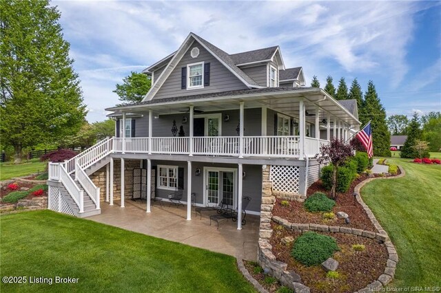 264 Cedarwood Rd, Bedford, KY 40006 - rear view of property featuring a yard, roof with shingles, stairway, and a patio area