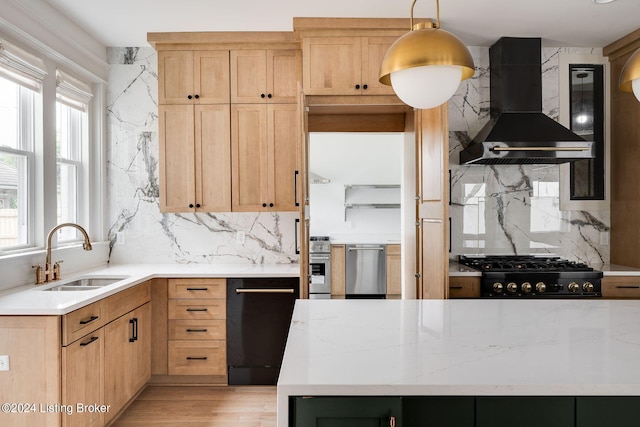 kitchen featuring decorative backsplash, sink, exhaust hood, and plenty of natural light