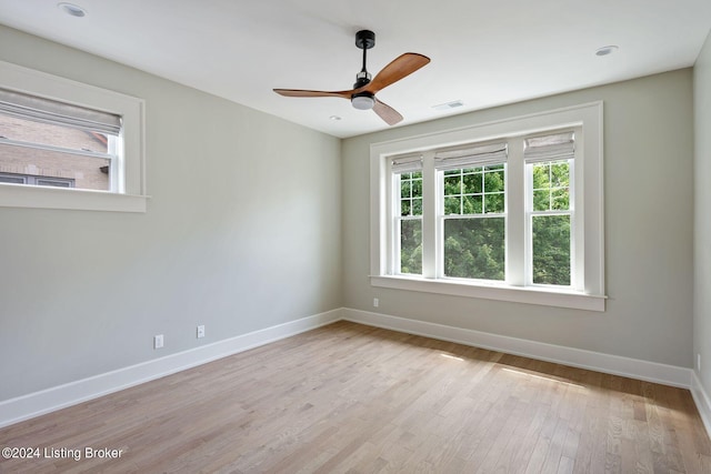 unfurnished room with ceiling fan and light hardwood / wood-style floors