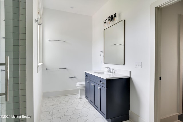 bathroom featuring walk in shower, vanity, toilet, and tile patterned floors