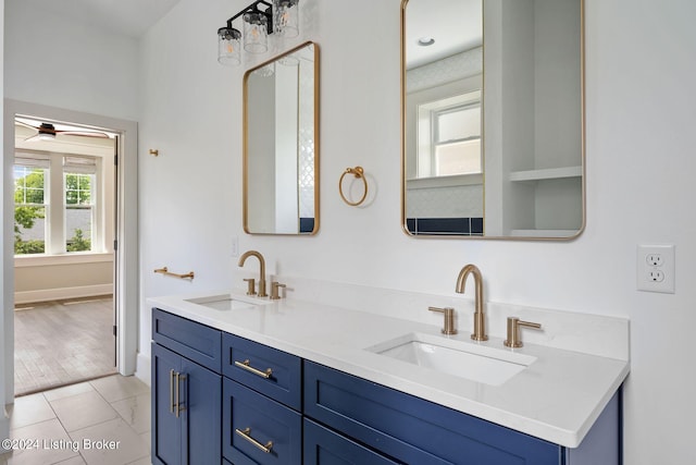 bathroom featuring tile patterned flooring and vanity