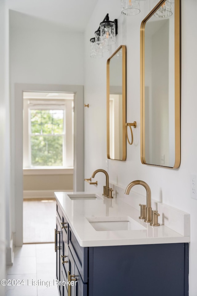 bathroom with vanity and tile patterned flooring